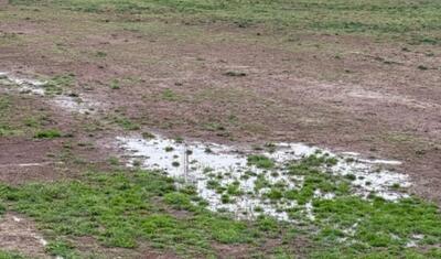 Güclü yağış stadionu yararsız hala saldı, oyunun yeri dəyişdirildi -